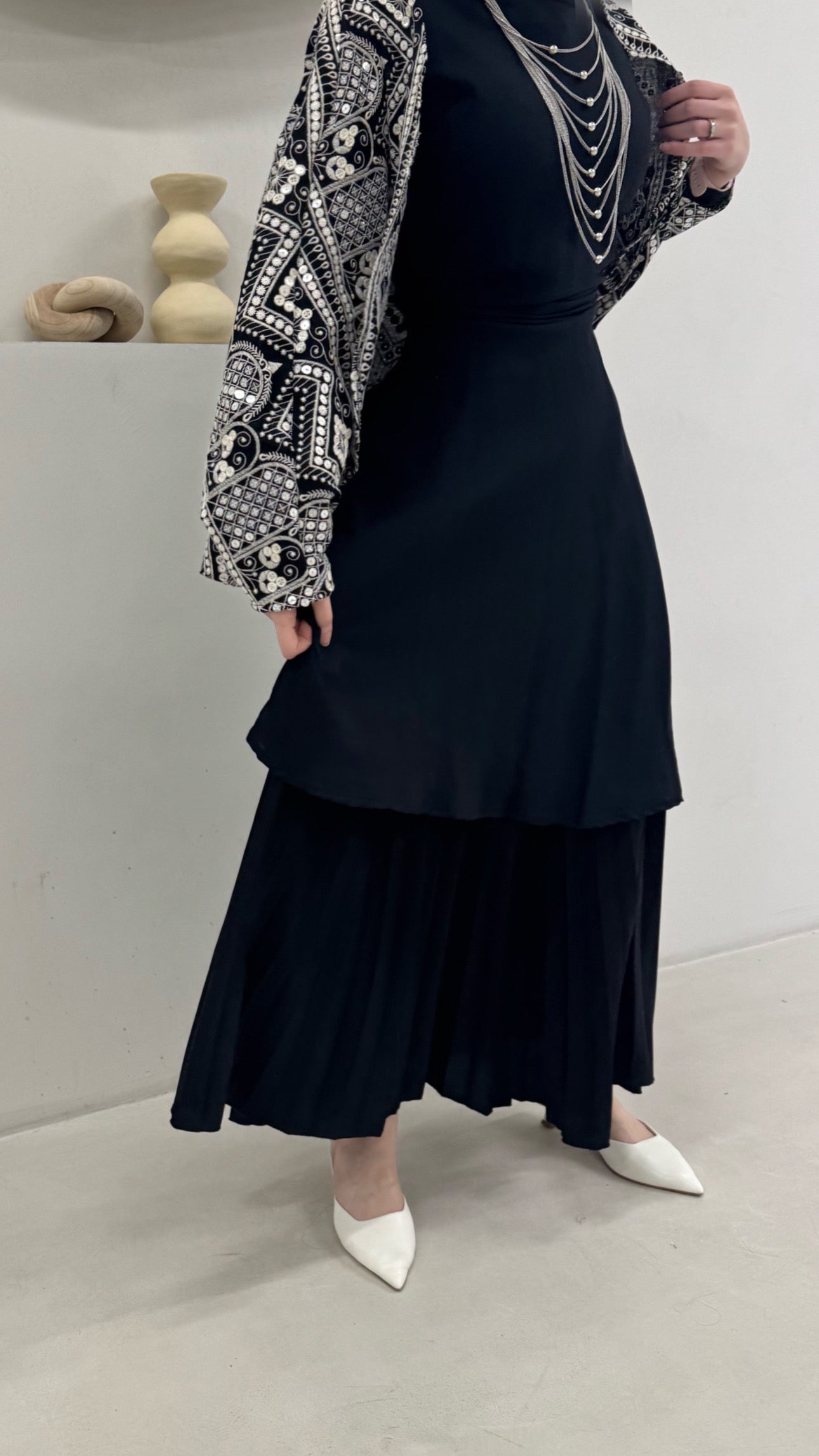 Black dress with mini bisht